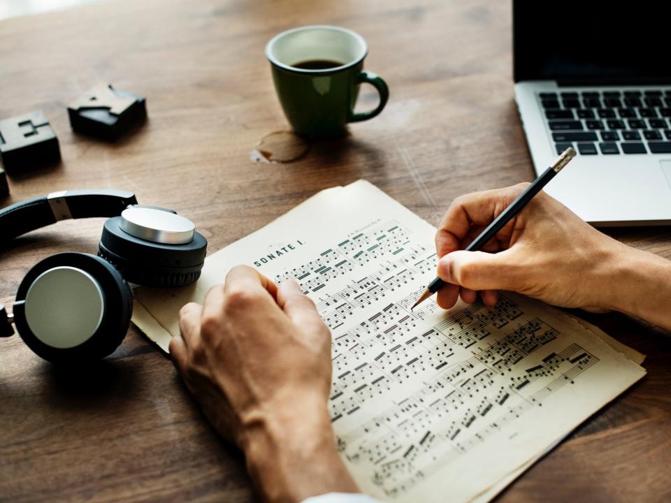 Person Marking up Music Score (Stock Image)